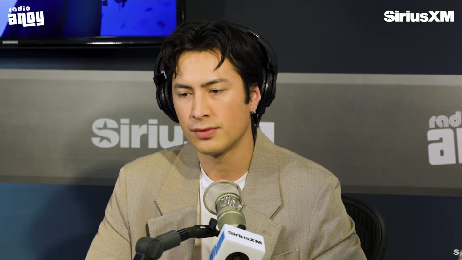 Heated Rivalry star Hudson Williams with Andy Cohen