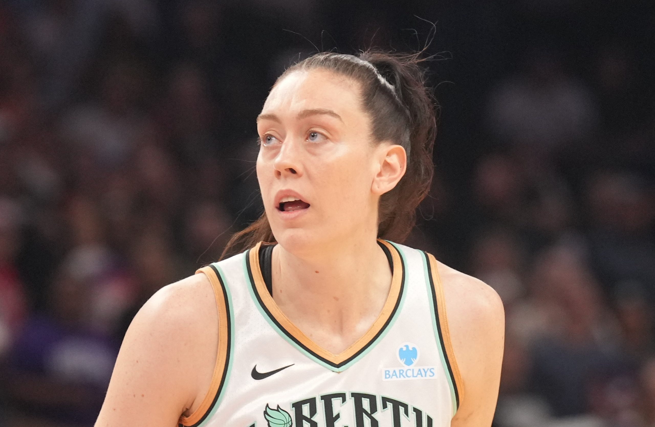 WNBA star Breanna Stewart holds  Abolish ICE  sign after Minneapolis shooting