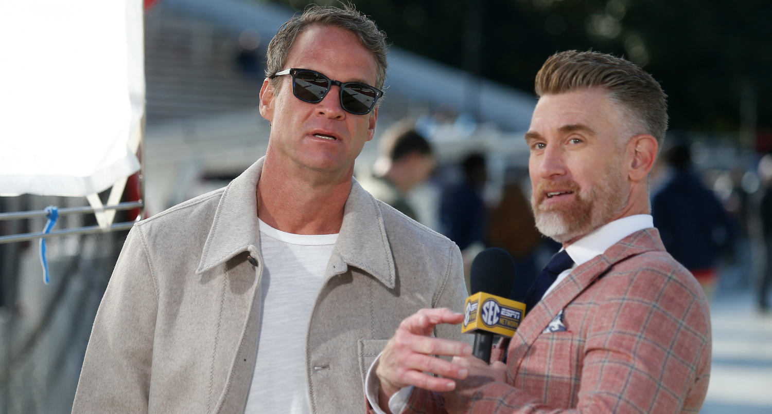 Nov 28, 2025; Starkville, Mississippi, USA; Mississippi Rebels head coach Lane Kiffin speaks with ESPN reporter Marty Smith before the game against the Mississippi State Bulldogs at Davis Wade Stadium at Scott Field. Mandatory Credit: Petre Thomas-Imagn Images