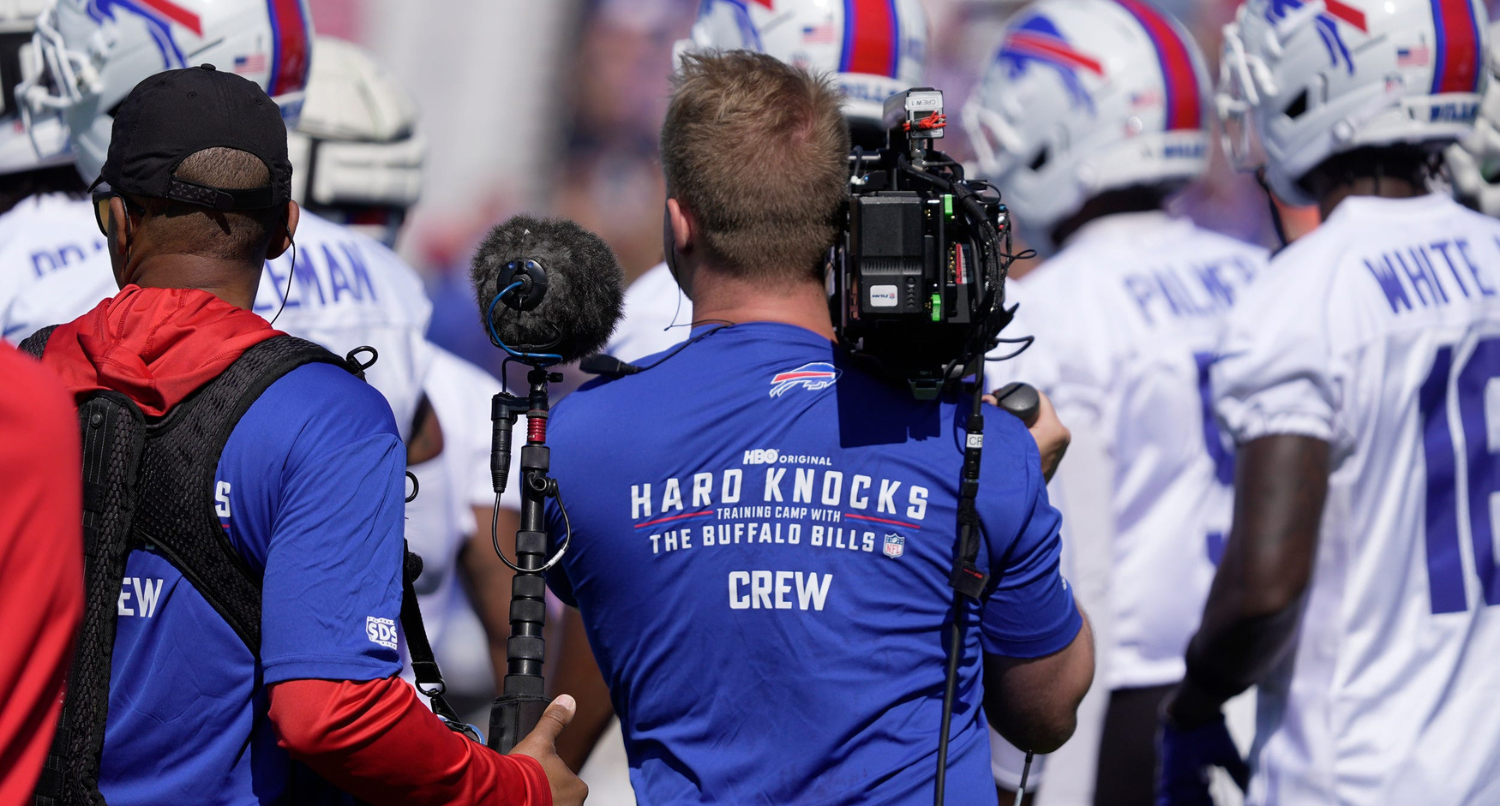 A NFL Crew from Hard Knocks follows the Bills on the field during opening day of the Buffalo Bills training camp at St. John Fisher University in Pittsford on July 23, 2025.