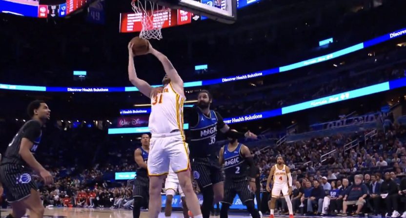 Orlando Magic center Goga Bitadze fouls Atlanta Hawks' Jock Landale
