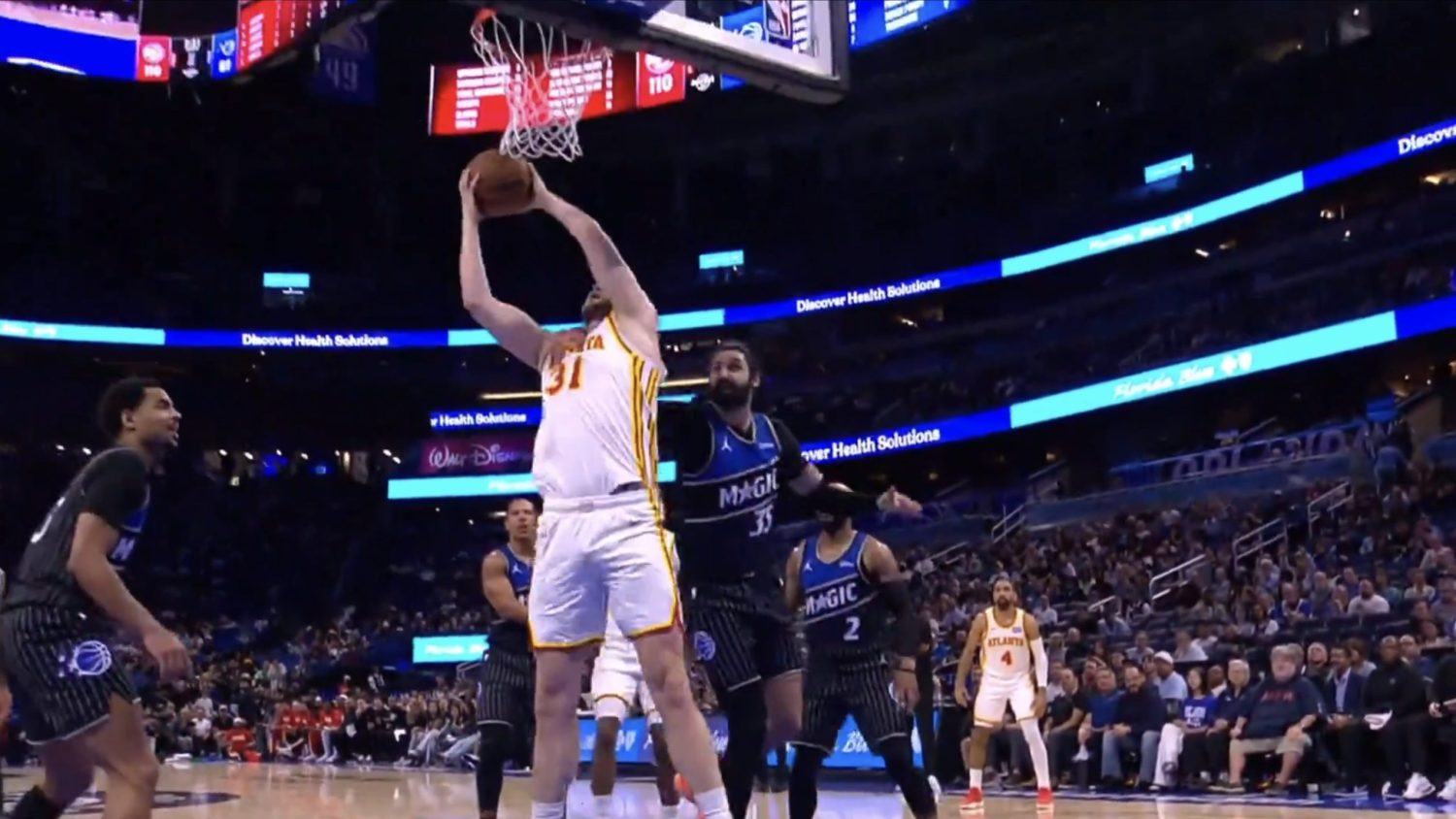 Orlando Magic center Goga Bitadze fouls Atlanta Hawks' Jock Landale