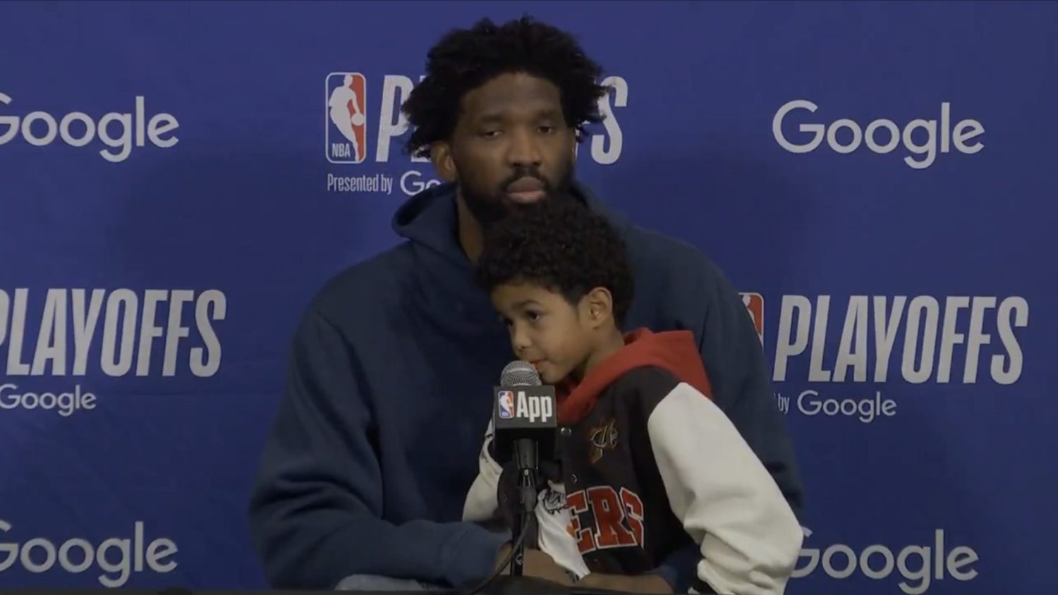 Joel Embiid and his son during postgame press conference