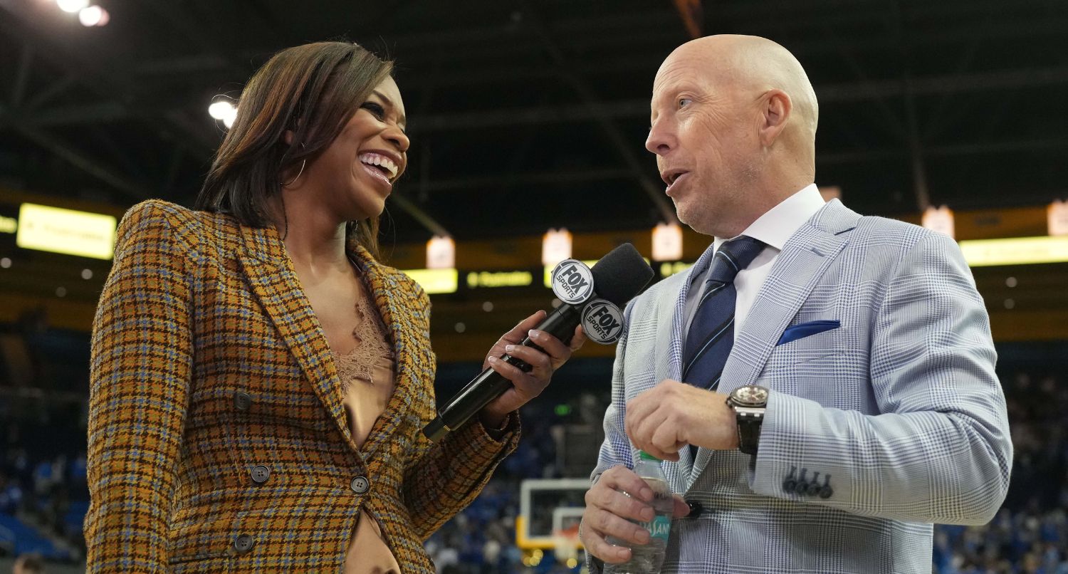 Mar 8, 2025; Los Angeles, California, USA; Fox Sports reporter Kristina Pink (left) interviews UCLA Bruins head coach Mick Cronin after the game against the Southern California Trojans at Pauley Pavilion presented by Wescom. Mandatory Credit: Kirby Lee-Imagn Images