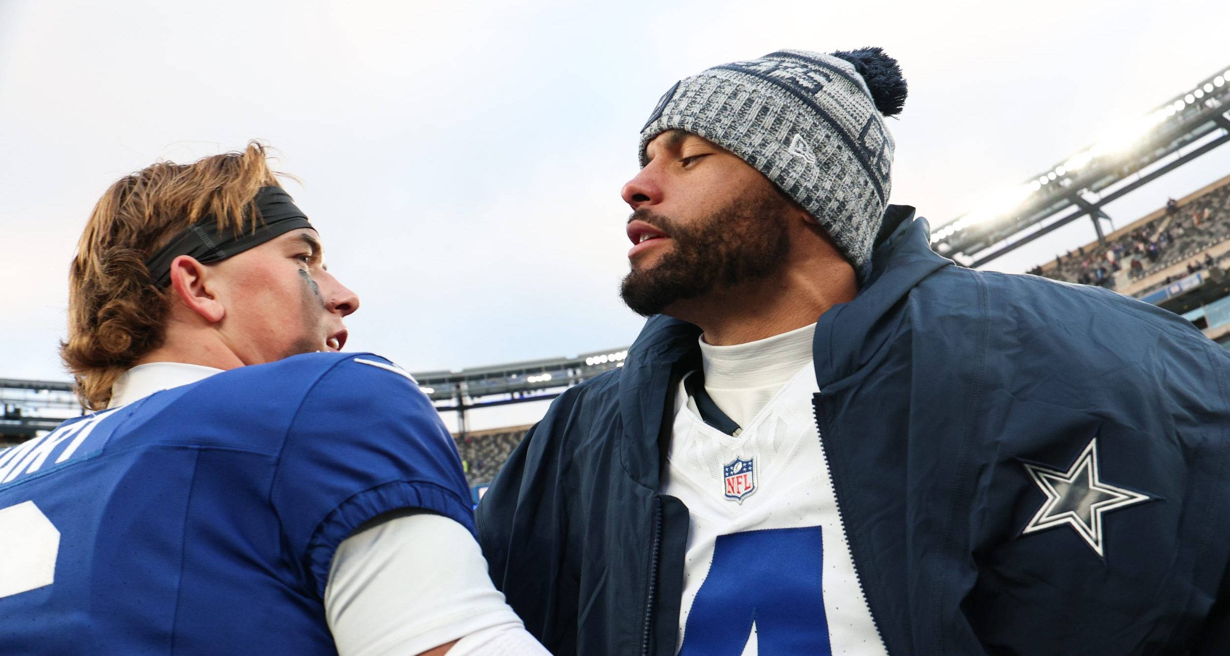 New York Giants quarterback Jaxson Dart (6) greets Dallas Cowboys quarterback Dak Prescott (4)