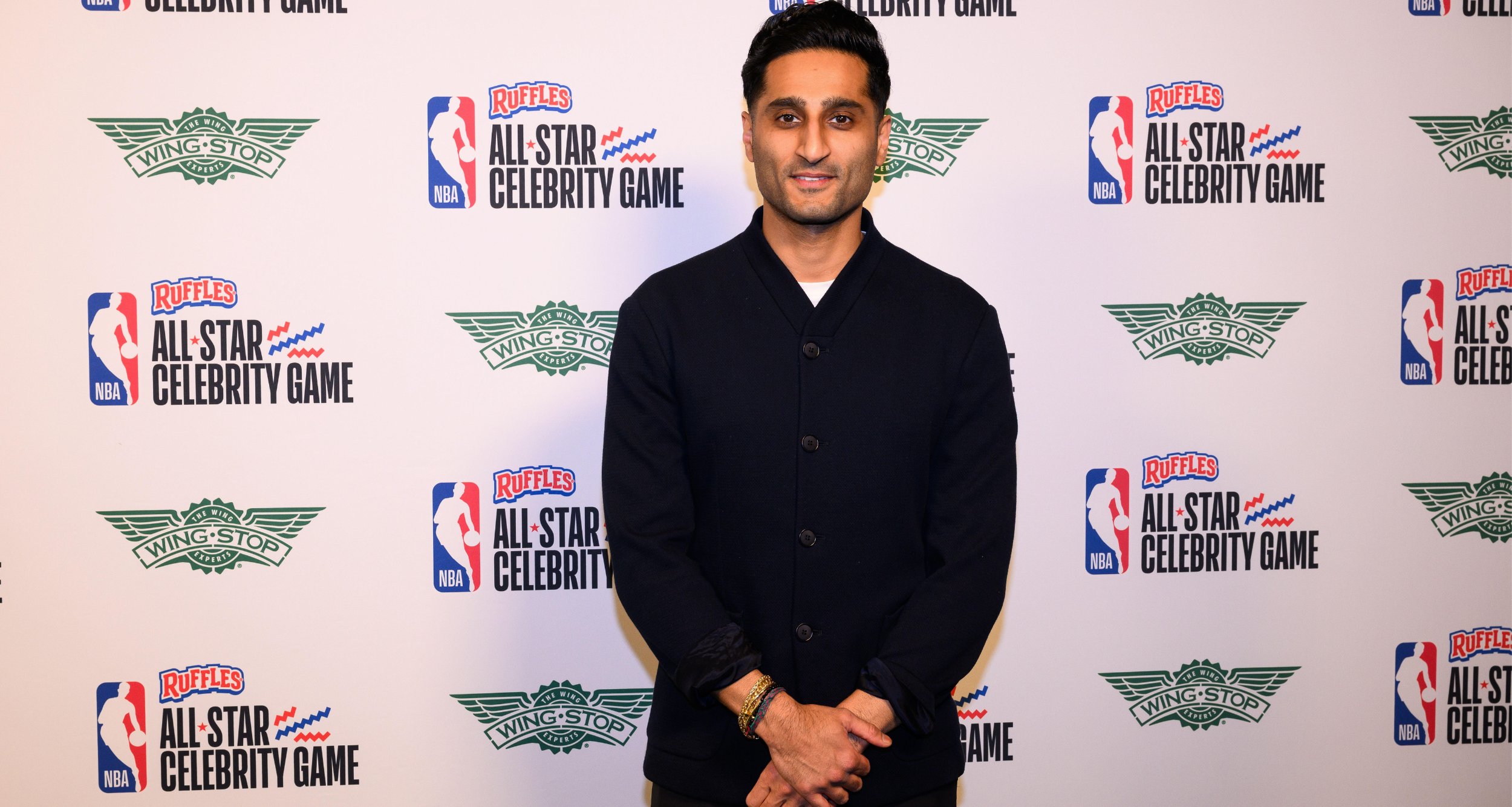 Feb 13, 2026; Los Angeles, CA, USA; Shams Charania arrives on the green carpet prior to an NBA Celebrity All-Star basketball game at Kia Forum. Mandatory Credit: William Liang-Imagn Images