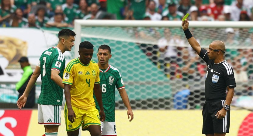 South Africa's Teboho Mokoena is shown a yellow card