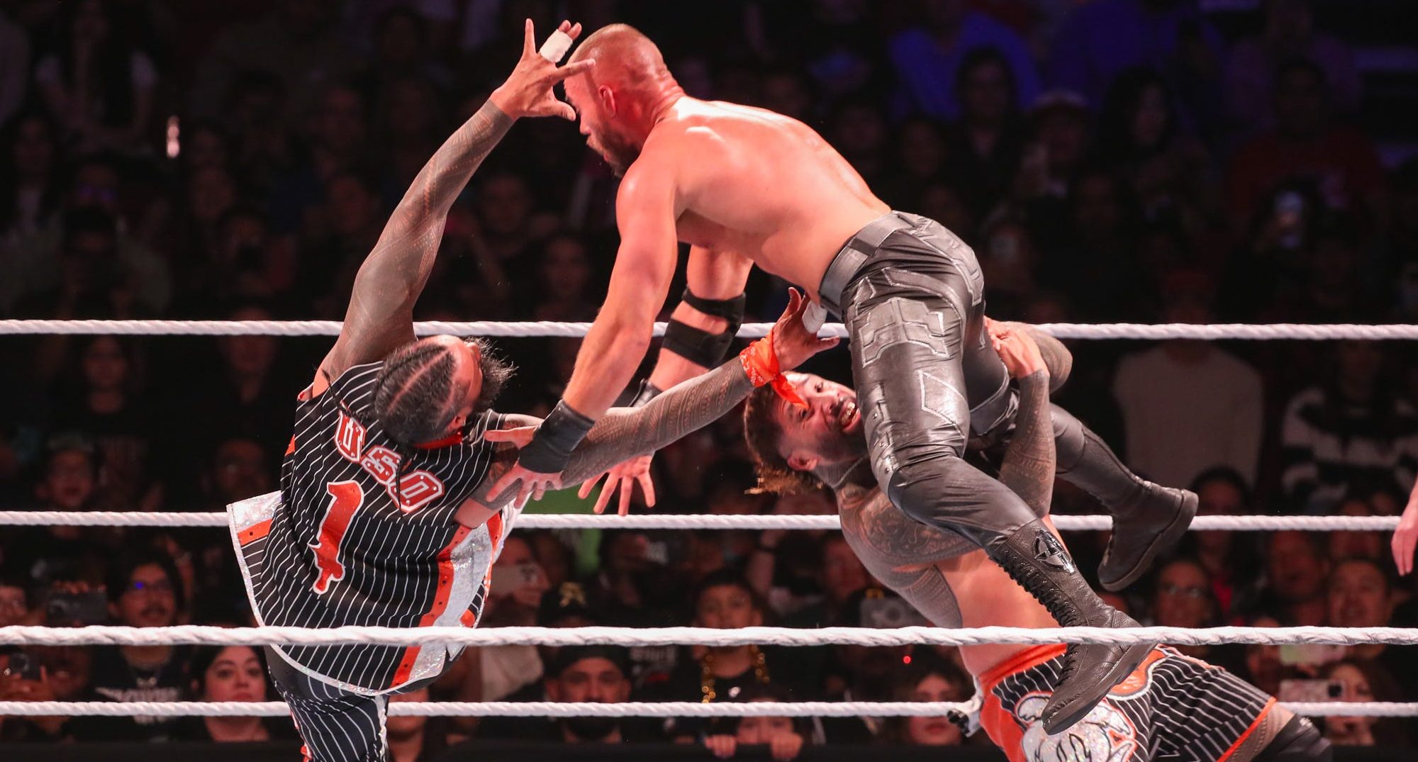 WWE Main Event Rumble partnership logo featuring professional wrestling stars