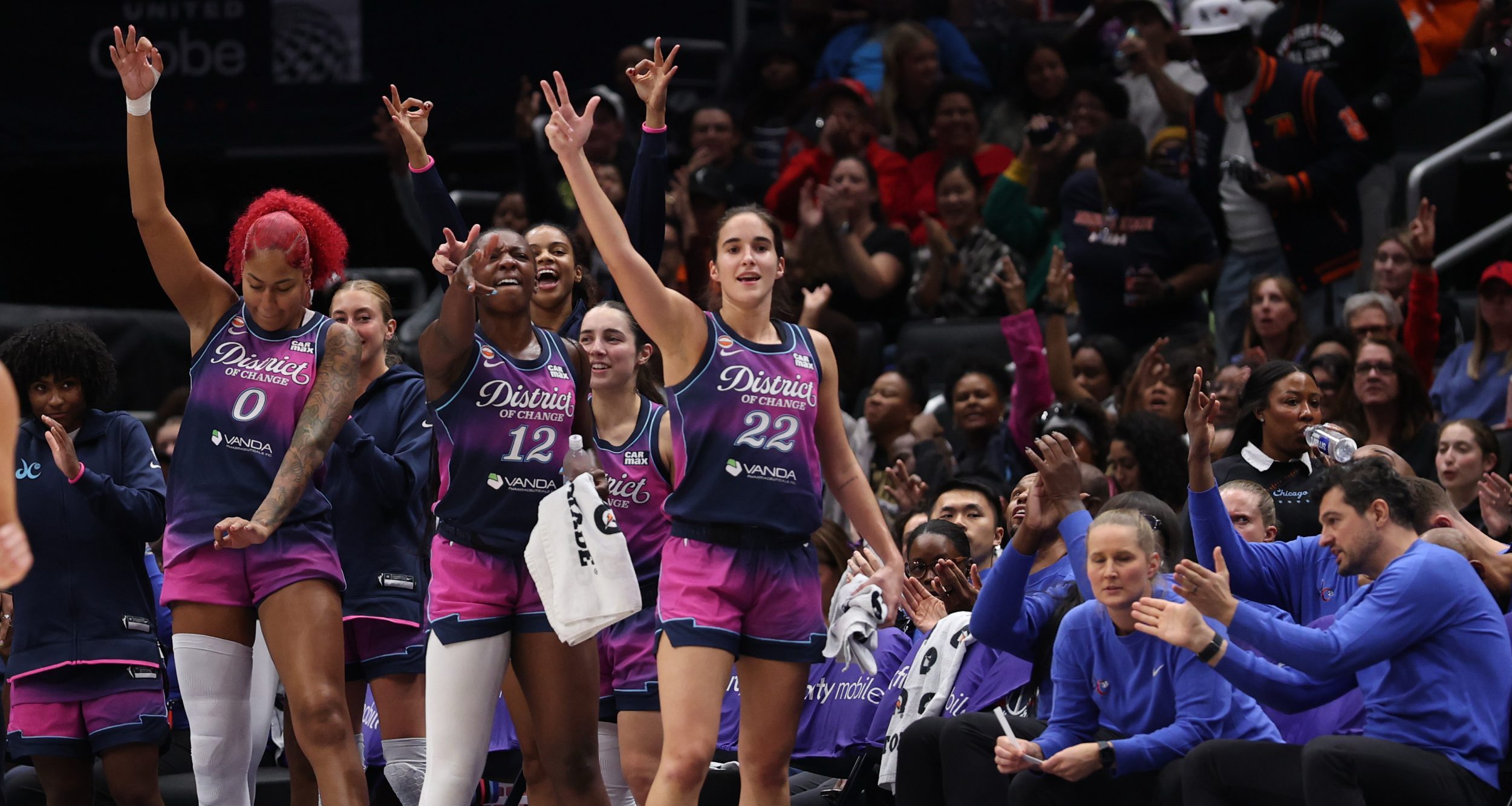 Washington Mystics players celebrate on the bench against the Chicago Sky during the second half at Capital One Arena.
