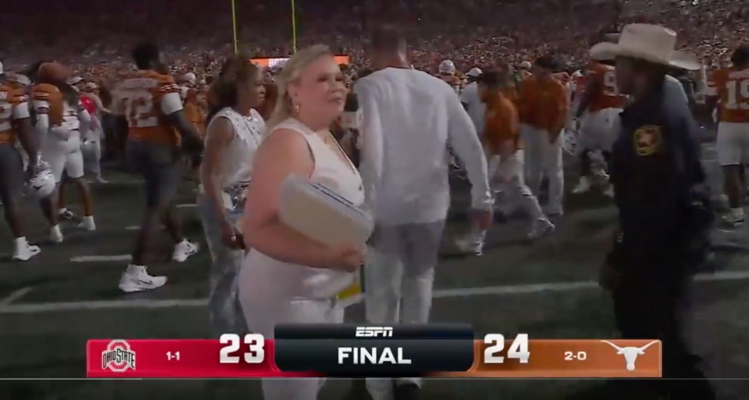 Steve Sarkisian walks away from interview with ESPN's Holly Rowe.